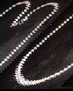 Fourteen-Karat White Gold and Diamond Graduaetd N: Fourteen-Karat White Gold and Diamond Graduated Necklace, composed of one-hundred-five round, brilliant-cut diamonds, total weight 9.17 carats, set in a graduated "S"-link necklace, l. 17".