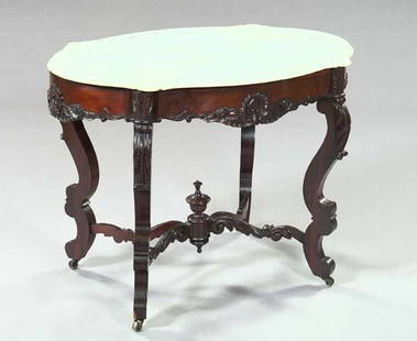 American Rococo Revival Rosewood and Marble-Top T: American Rococo Revival Rosewood and Marble-Top Center Table, third quarter 19th century, the rim with applied floral carvings and original conforming white marble top, with scrolled legs with