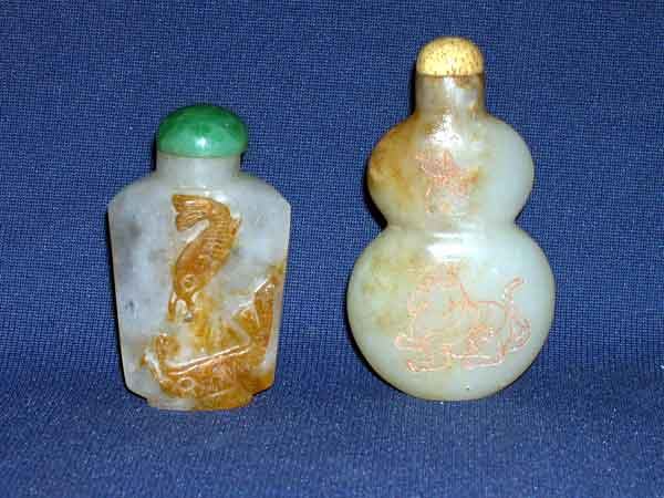 Group of Two Snuff Bottles: Group of Two Snuff Bottles, consisting of a Chinese incise-carved "mutton fat" jade snuff bottle of double gourd form, first quarter 20th century, carved on the obverse with a curious kitten observing