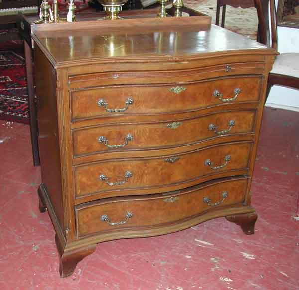 Edwardian Walnut Serpentine Chest: Edwardian Burl Walnut and Walnut Serpentine Chest of Four Drawers, c. 1900, in the manner of Thomas Chippendale, the top with book-matched veneer and banded inlay above a gilt-tooled emerald leather-i