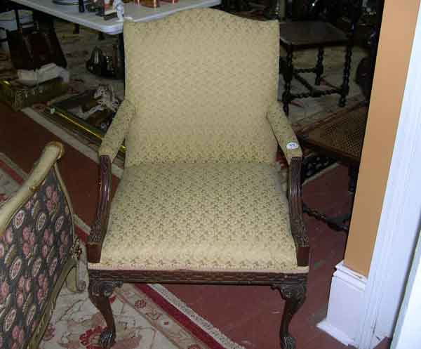 George III-Style Mahogany Armchair: George III-Style Mahogany "Gainsborough" Armchair, in the Chinese taste of Thomas Chippendale, upholstered in a gold floral and foliate trellis-patterned fabric, h. 37", w. 25", d. 21".