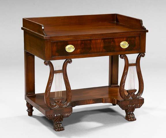American Mahogany Dressing Table: American Classical-Style Mahogany Dressing Table, in the manner of Duncan Phyfe, New York, late 19th century, the rectangular overhanging top with a single long drawer below and supported by acanthus-