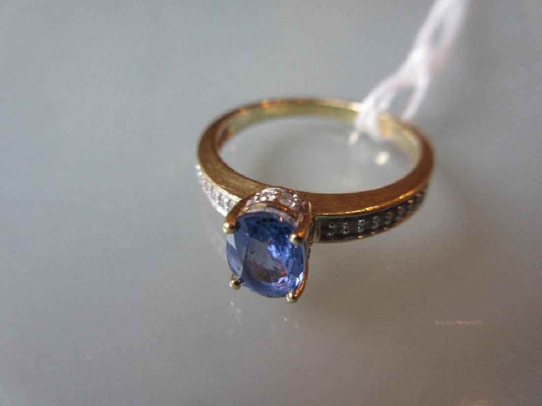 18ct Gold ring set oval sapphire with diamond set (1 of 1)