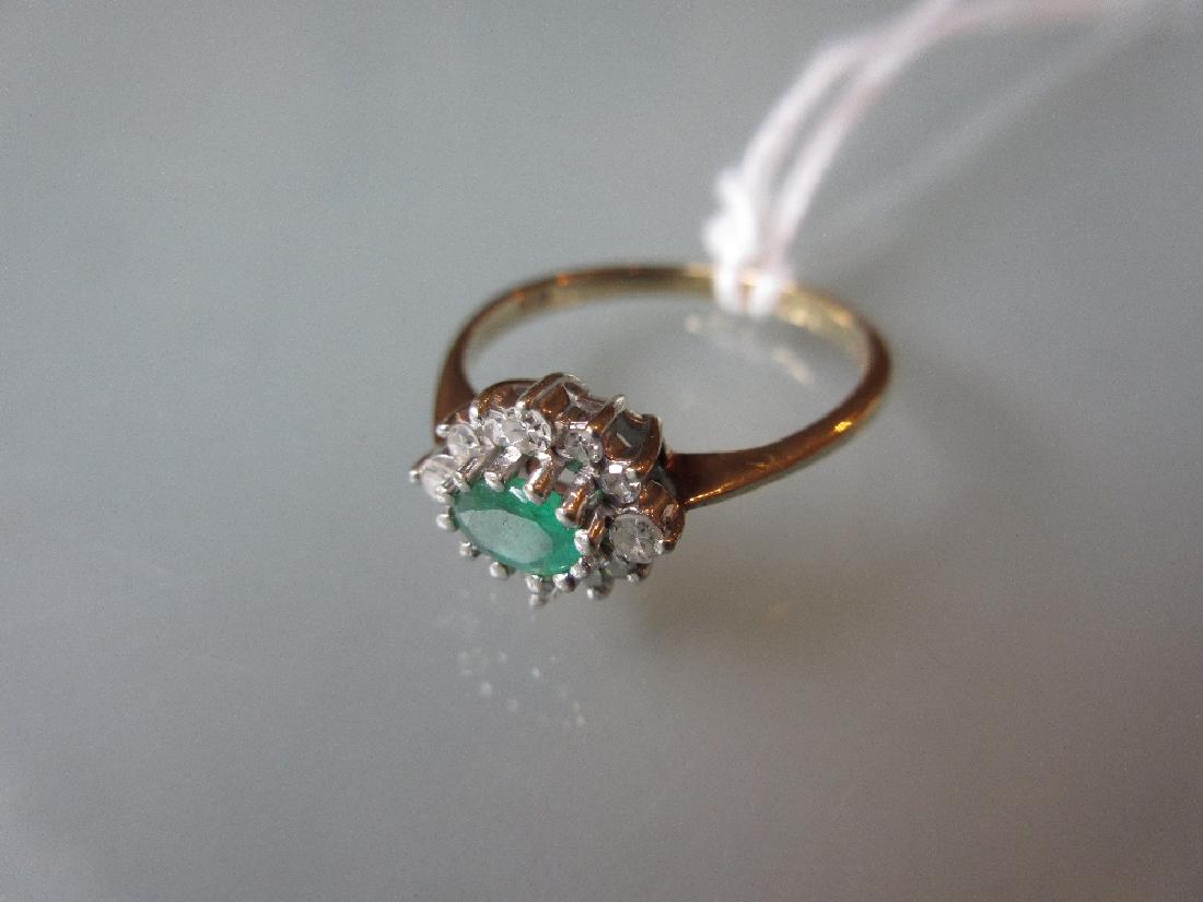 9ct Gold oval emerald and diamond cluster ring (1 of 1)