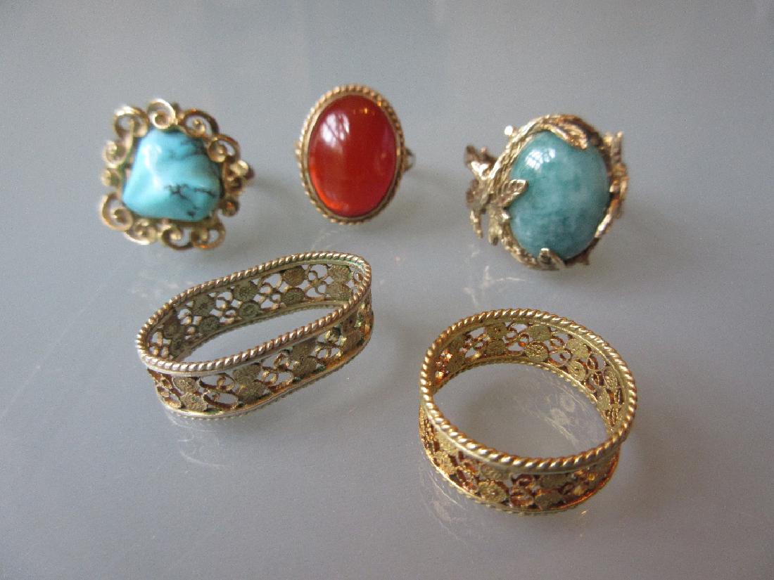 Three various gold dress rings together with two (1 of 1)