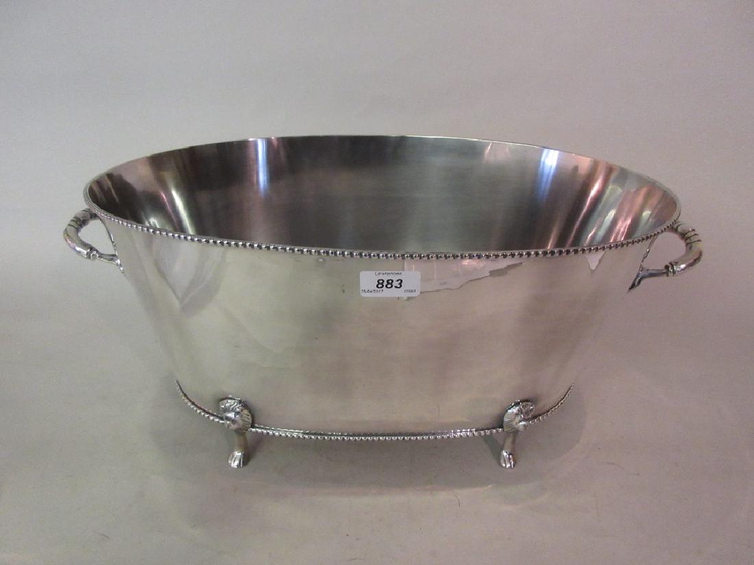 Large silver plated oval two handled wine cooler on low: Large silver plated oval two handled wine cooler on low supports