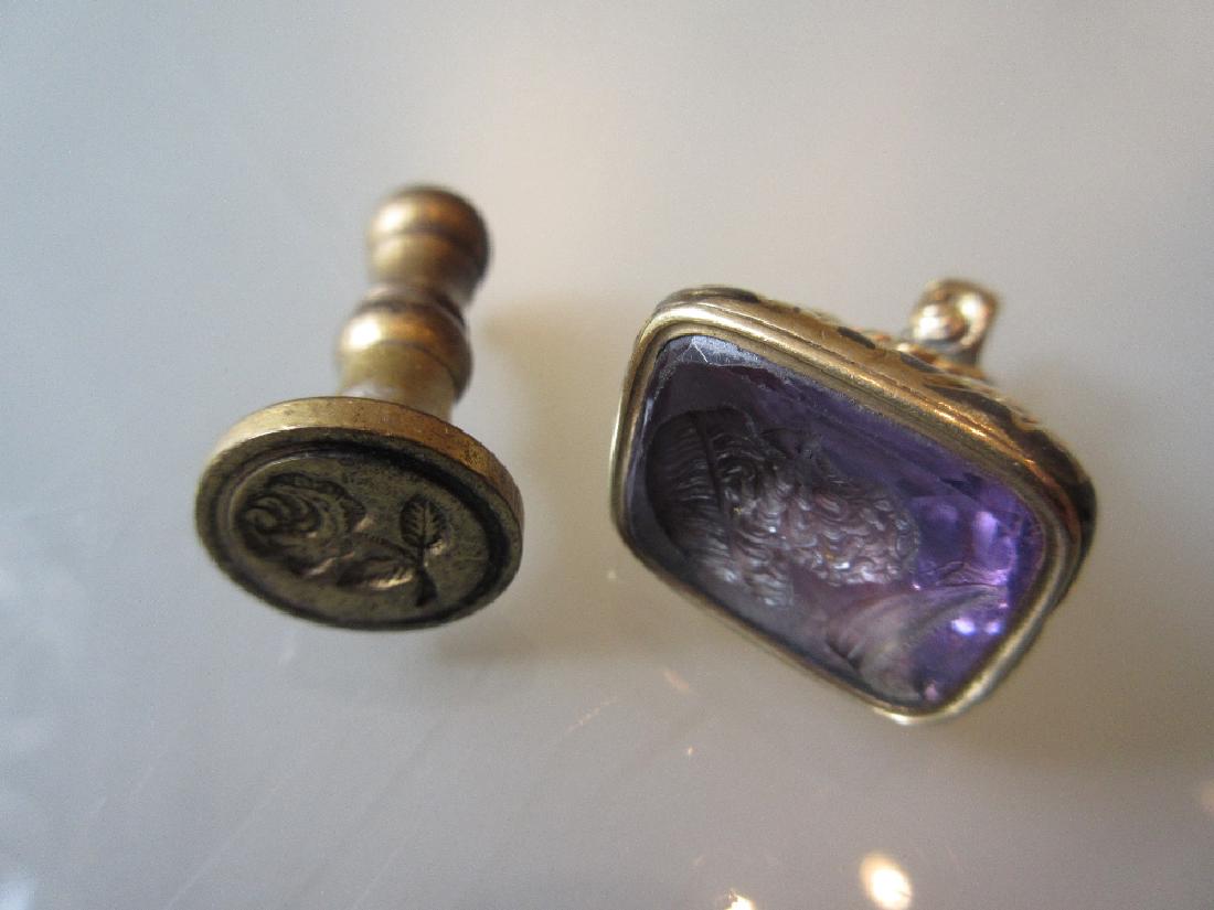 Victorian yellow metal intaglio set seal together with: Victorian yellow metal intaglio set seal together with a brass seal
