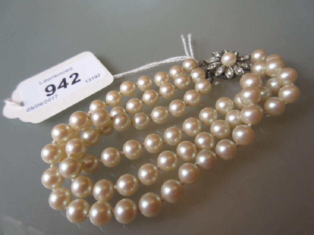 Triple row uniform cultured pearl bracelet with a (1 of 1)