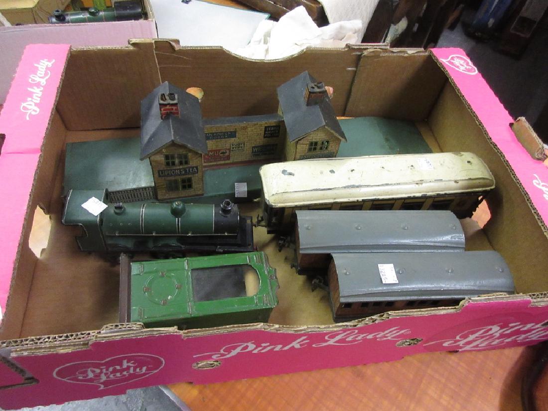 Bing 0 gauge clockwork engine (a/f), three various: Bing 0 gauge clockwork engine (a/f), three various carriages, a station and a platform timetable display cabinet