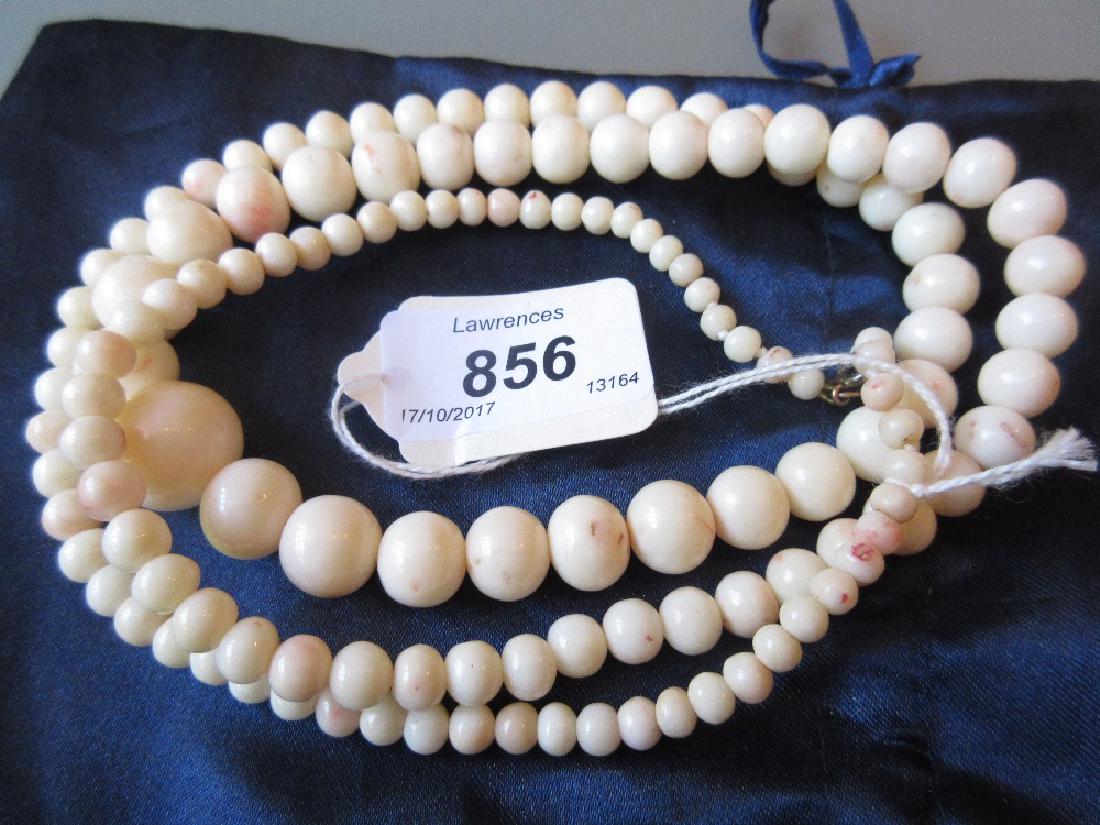 Long Angel Skin coral bead graduated necklace: Long Angel Skin coral bead graduated necklace