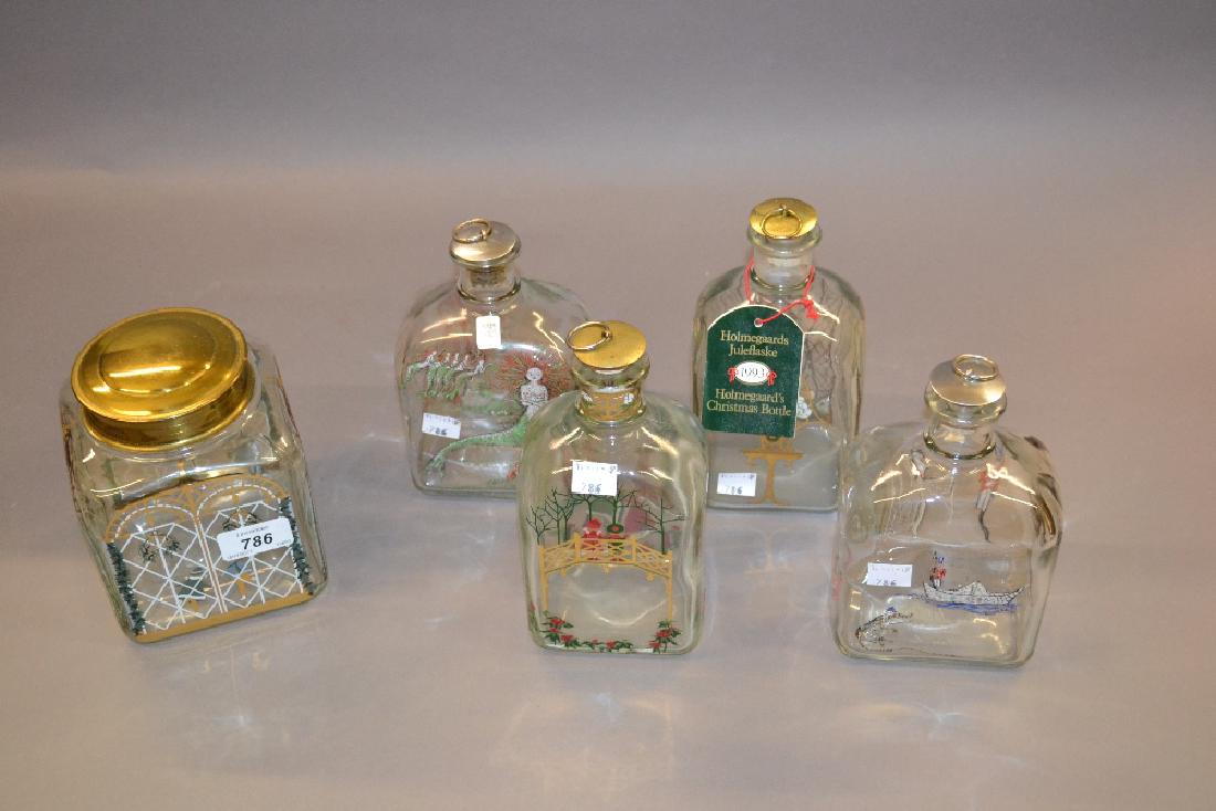 Four Holmegaard Christmas decanters and a biscuit jar: Four Holmegaard Christmas decanters and a biscuit jar