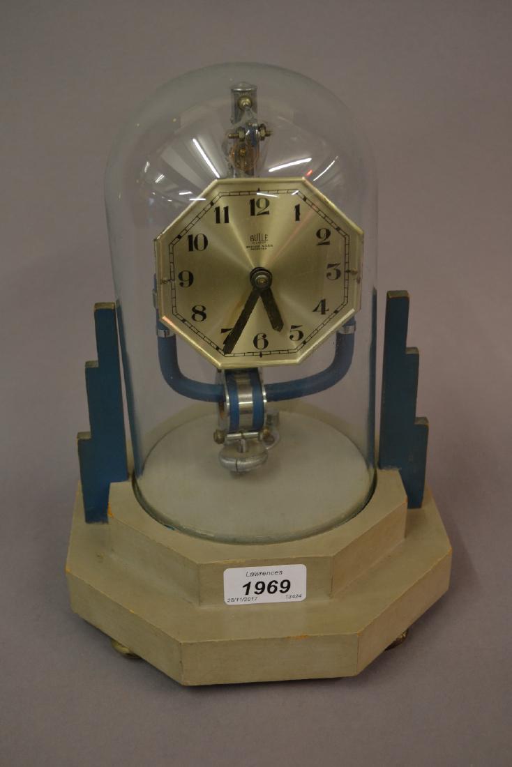 Brulle electric mantel clock, the 3.5in octagonal: Brulle electric mantel clock, the 3.5in octagonal silvered dial under a glass dome on an octagonal stepped wooden base, 11ins high