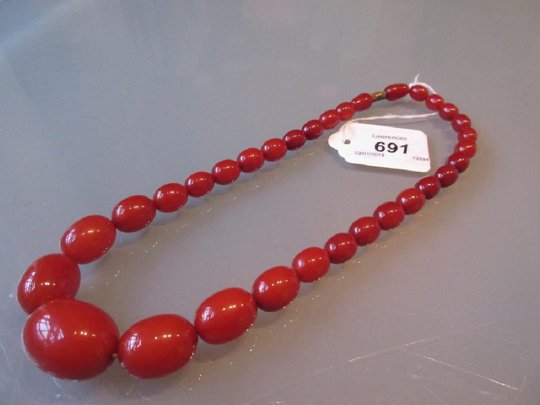 Graduated amber coloured bead necklace (1 of 1)