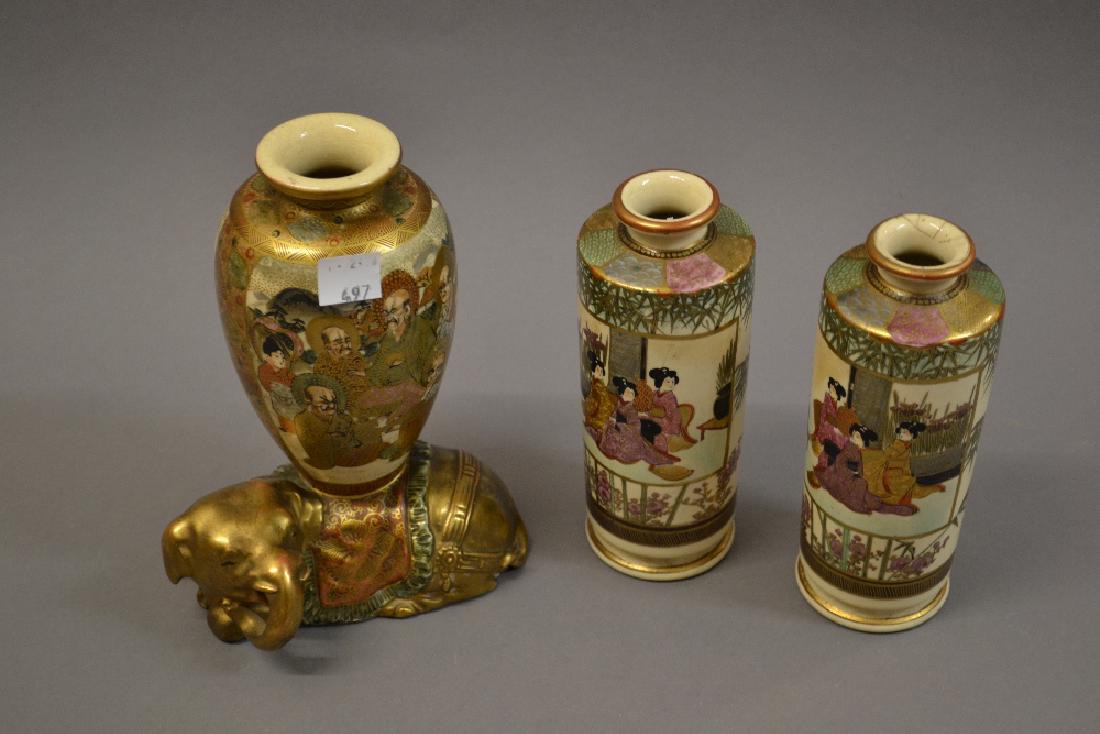 Pair of Satsuma cylindrical vases painted with panels: Pair of Satsuma cylindrical vases painted with panels of geishas (one at fault) together with a Satsuma vase with elephant base, 7ins high