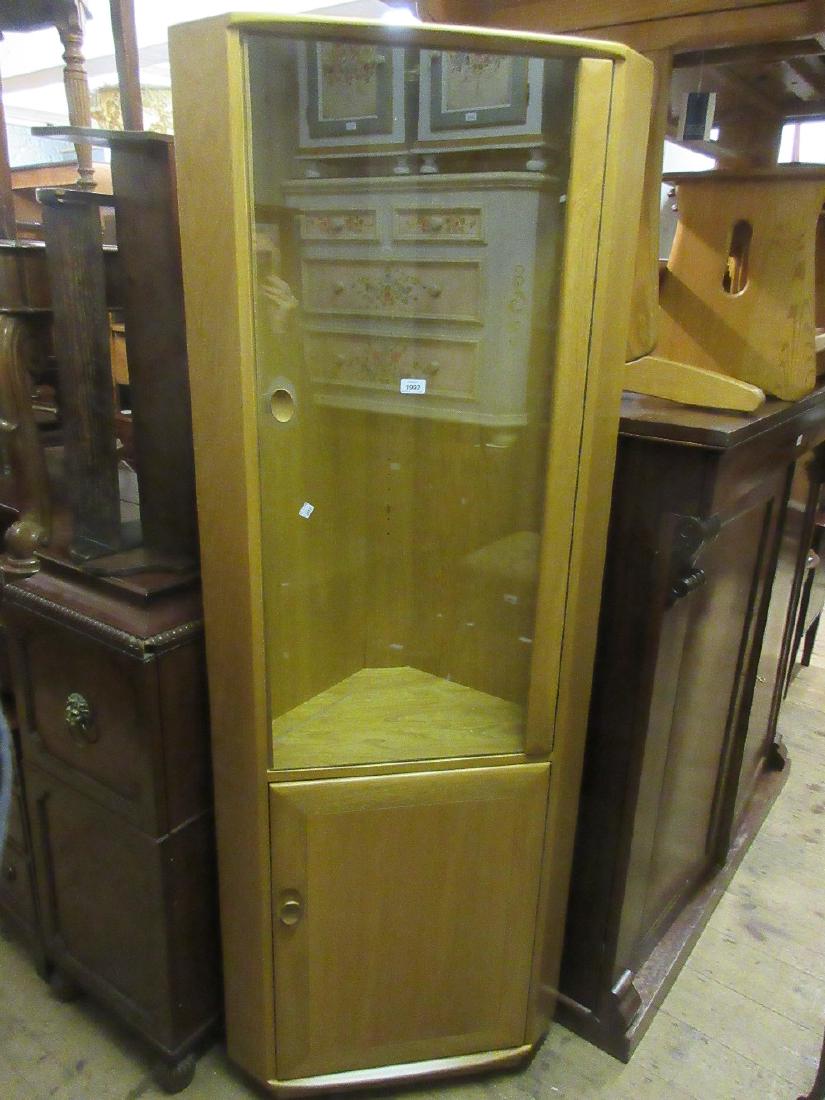 Modern Ercol standing corner cabinet with glazed upper: Modern Ercol standing corner cabinet with glazed upper section and panelled door