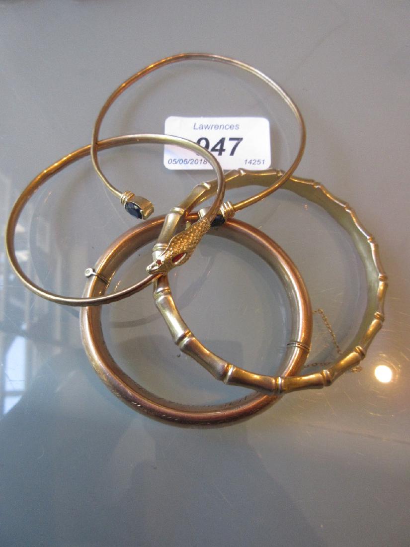 9ct Gold bangle in the form of a serpent together with (1 of 2)
