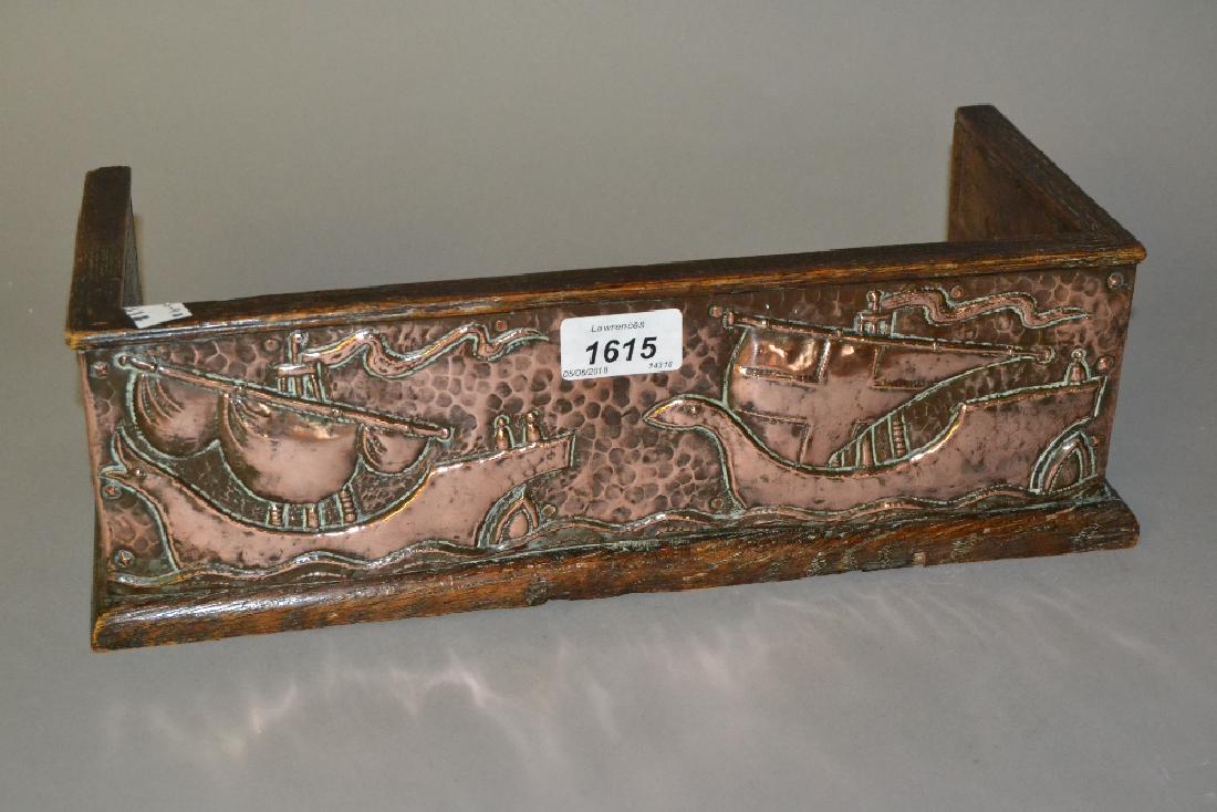 John Pearson, Arts and Crafts copper and oak bookrack: John Pearson, Arts and Crafts copper and oak bookrack embossed with galleons and fish, 13.5ins wide, unsigned