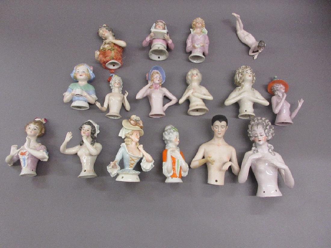 Box containing a collection of fifteen various large: Box containing a collection of fifteen various large porcelain half dolls, together with a similar reclining nude doll