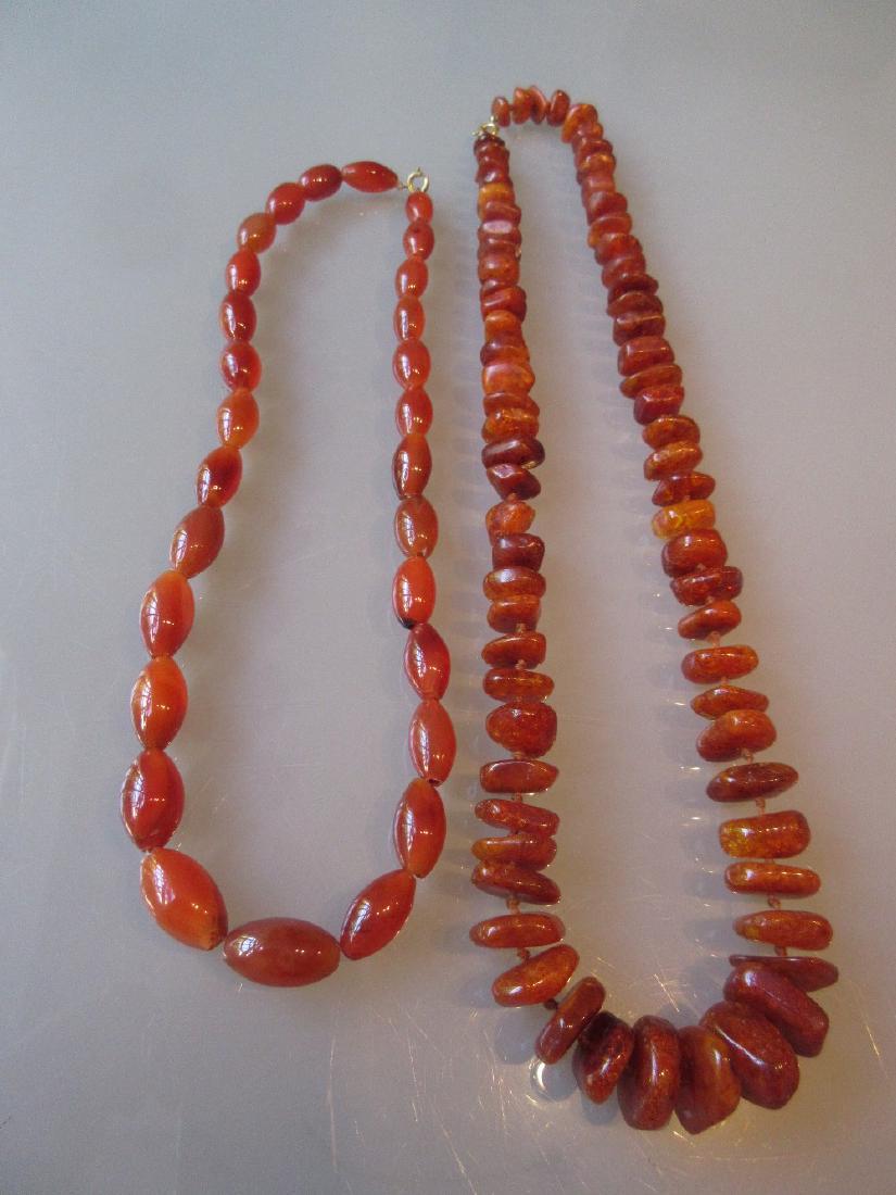 Amber coloured bead necklace and an agate graduated (1 of 2)