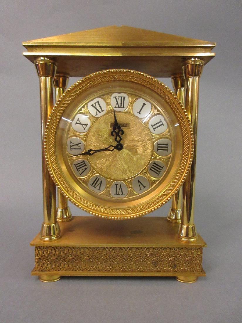 Heavy gilt brass cased mantel clock having circular (1 of 1)