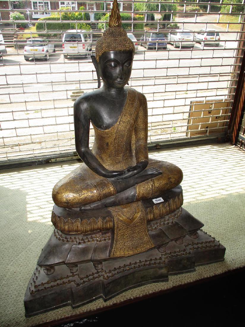 Large dark patinated and gilt bronze figure of seated (1 of 2)