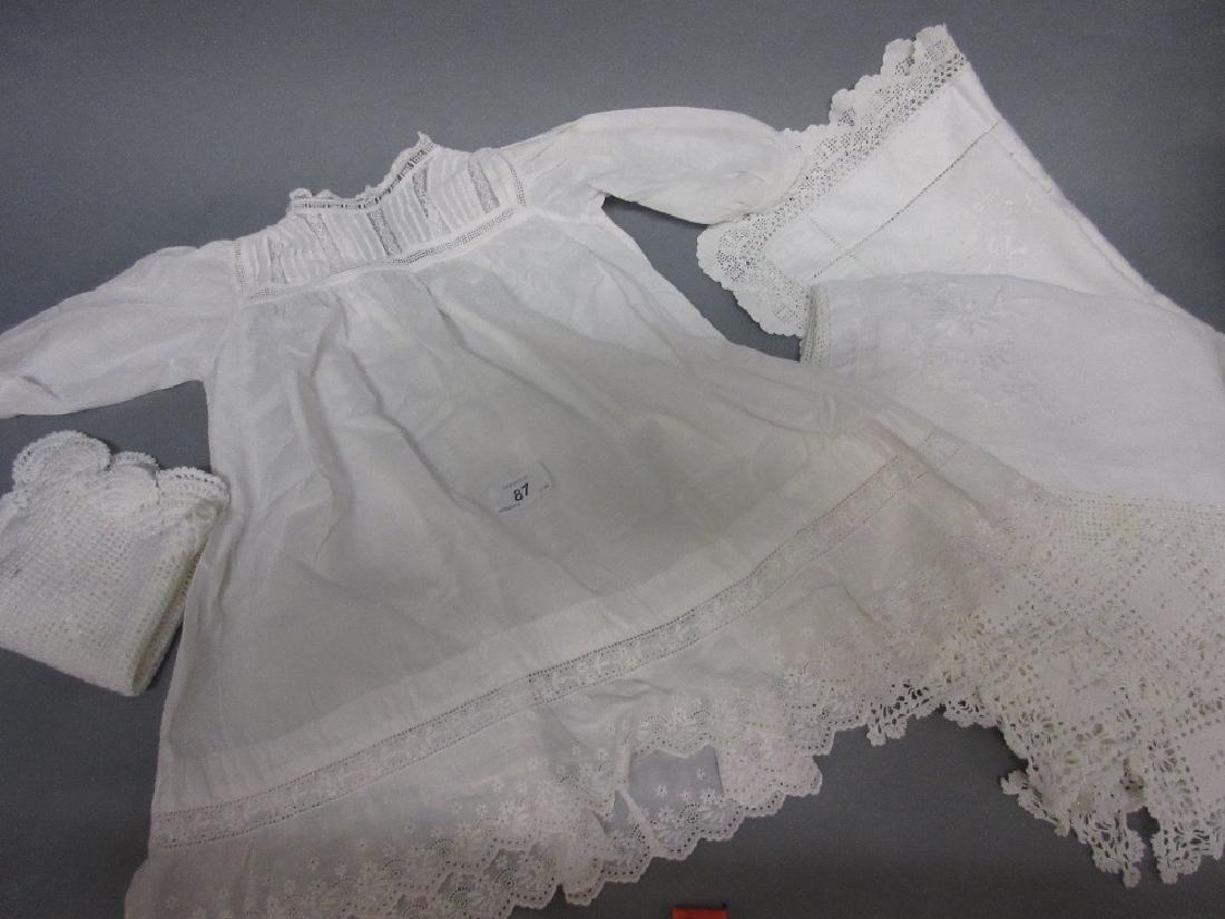 Quantity of white embroidered table linen and baby (1 of 1)