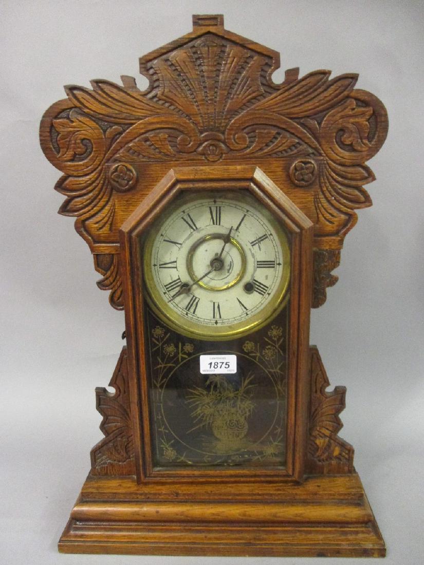 Continental oak cased mantel clock having carved (1 of 1)