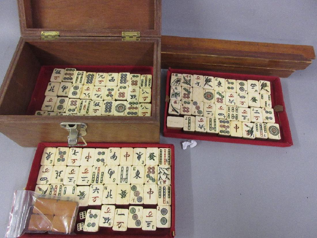 Chinese bone and bamboo mahjong set in a later made: Chinese bone and bamboo mahjong set in a later made casket, retaining original trays (at fault), including counter holders