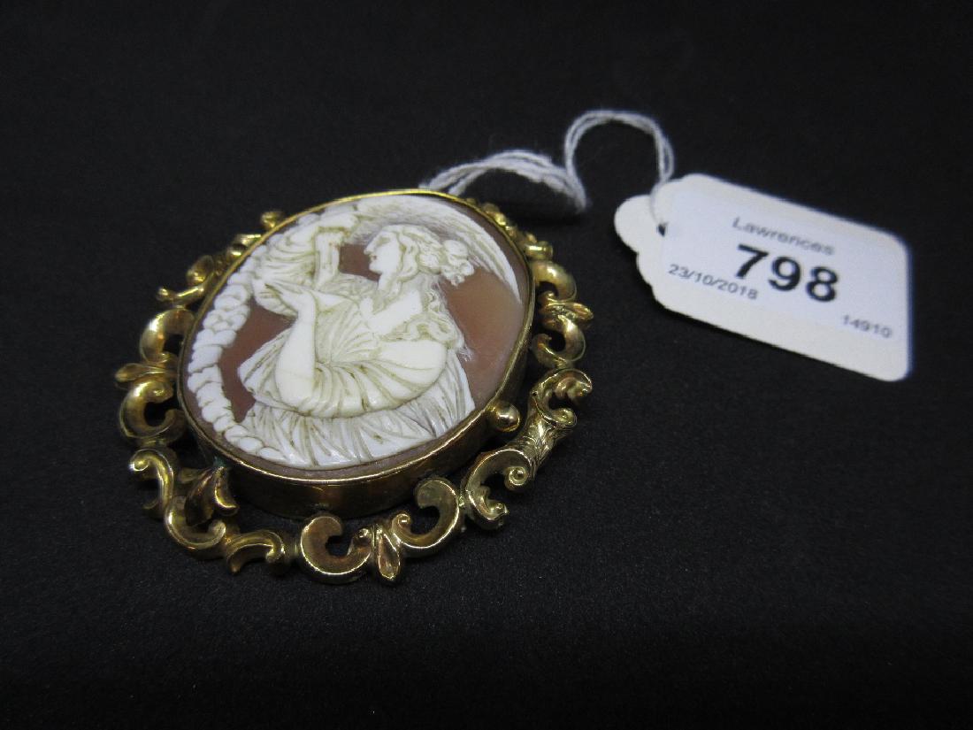 Victorian oval yellow metal mounted carved shell cameo: Victorian oval yellow metal mounted carved shell cameo memorial brooch