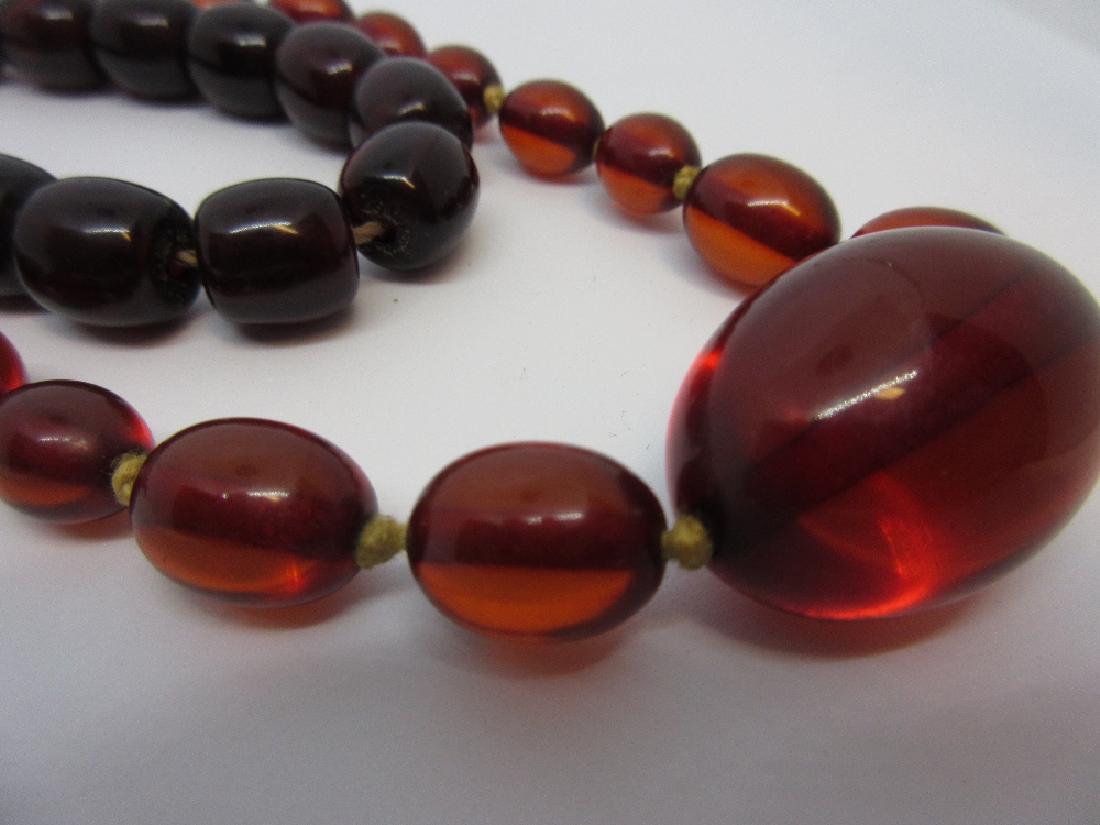 Two amber coloured bead necklaces (1 of 3)