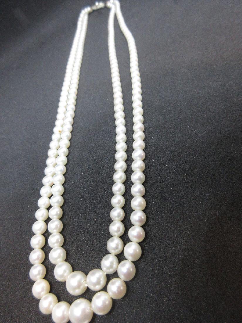 Mikimoto twin row graduated cultured pearl necklace: Mikimoto twin row graduated cultured pearl necklace with 9ct white gold clasp, housed in original case