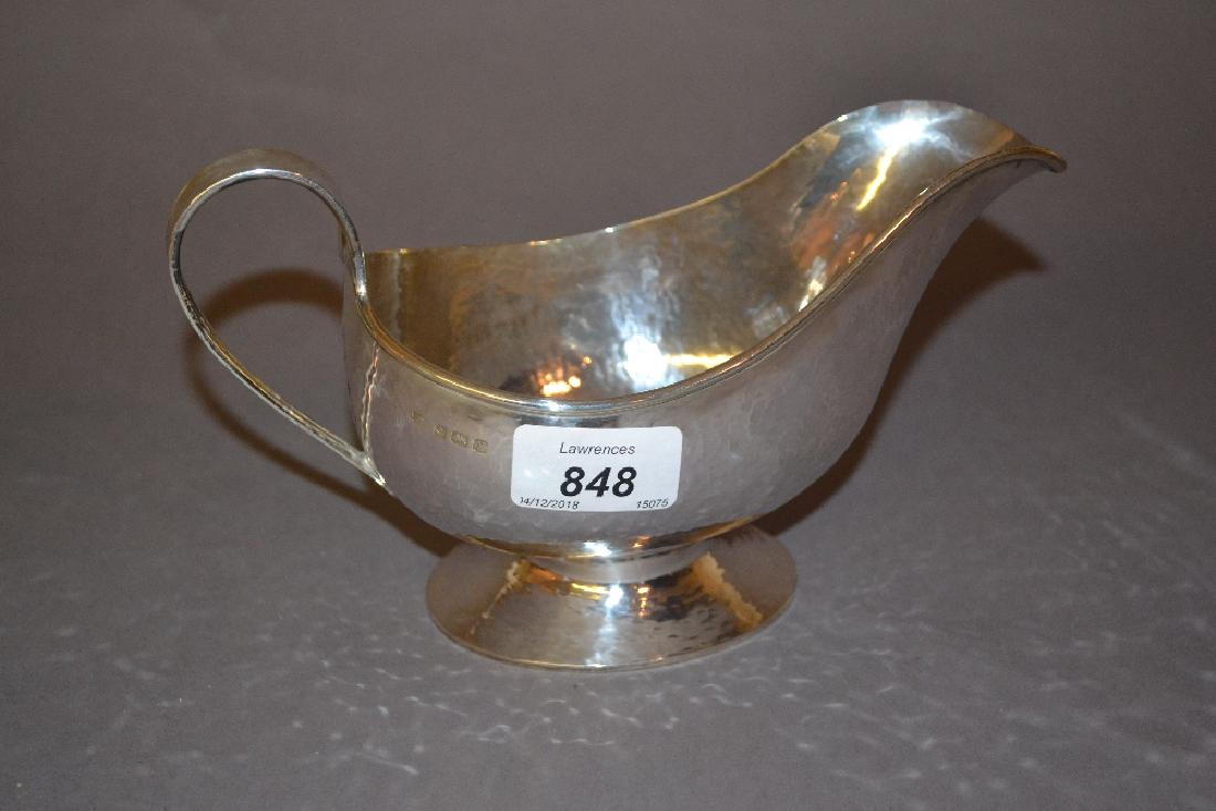 A.E. Jones, early 20th Century hand beaten pedestal: A.E. Jones, early 20th Century hand beaten pedestal sauce boat, Birmingham 1923