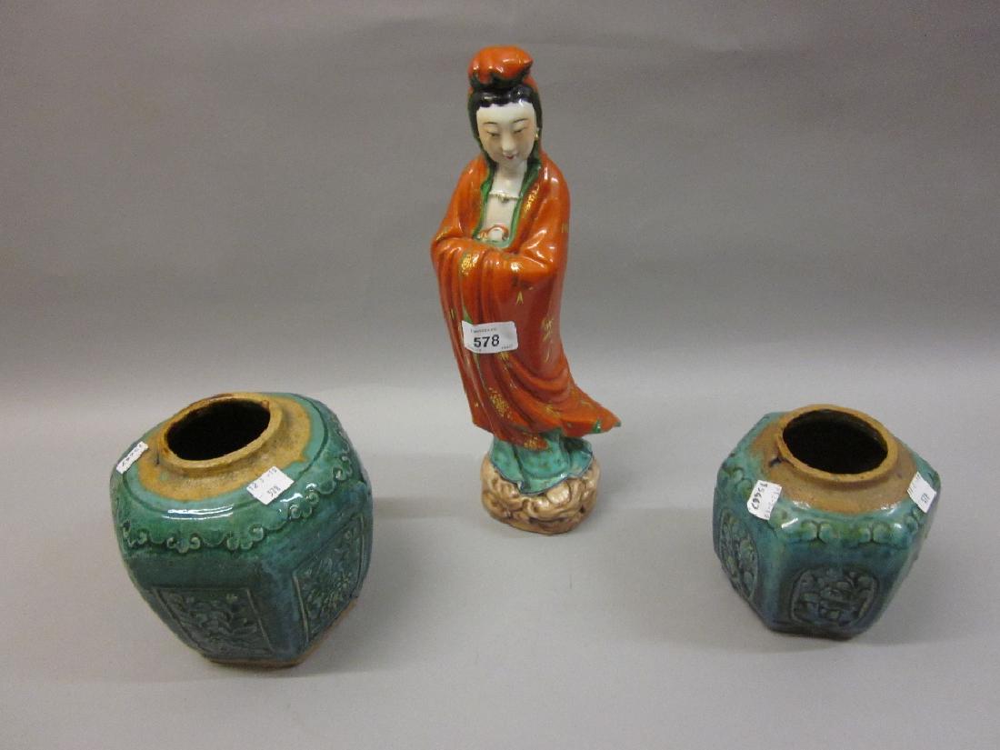 Chinese porcelain figure bearing character stamps to: Chinese porcelain figure bearing character stamps to base, 13.5ins high, together with two stoneware green glazed hexagonal ginger jars (lacking covers)