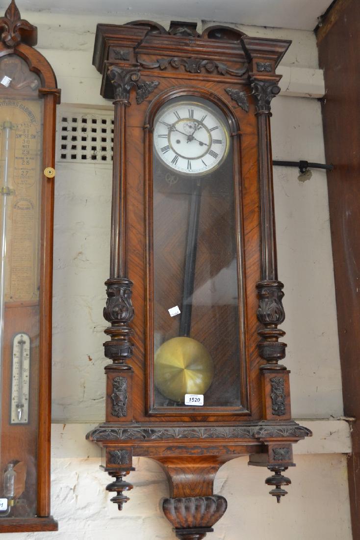 Late 19th Century walnut cased Vienna wall clock, the: Late 19th Century walnut cased Vienna wall clock, the enamel dial with Arabic numerals and subsidiary seconds dial with two train weight driven movement