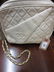 Ladies Chanel quilted cream leather shoulder bag with a