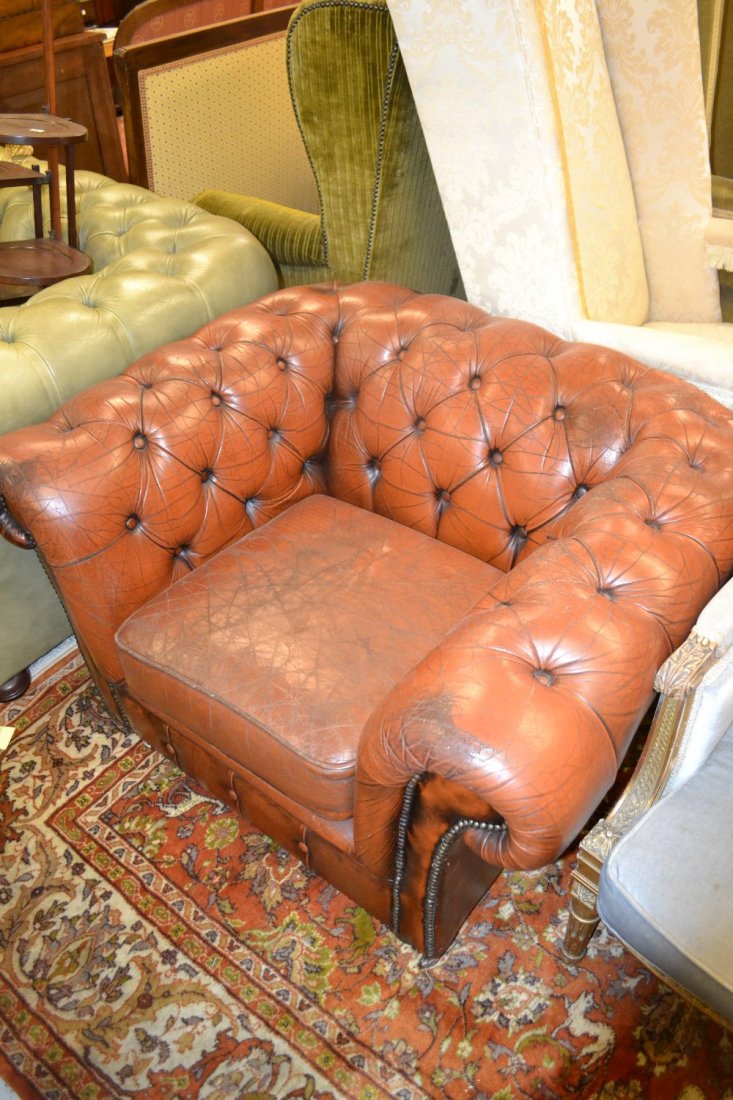 Brown leather button upholstered and brass studded: Brown leather button upholstered and brass studded Chesterfield armchair