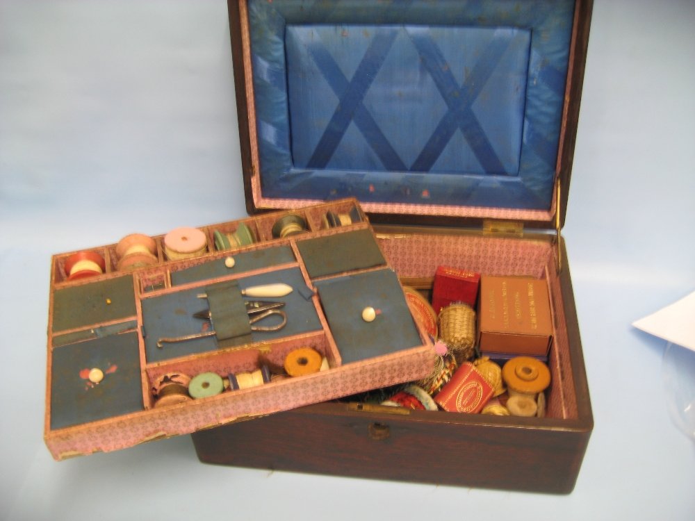19th Century rosewood work box, the fitted interior: 19th Century rosewood work box, the fitted interior housing a large quantity of needlework related items including: Tunbridge ware, Mauchline ware, vegetable ivory, needle cases, bobbins, bodkins, spo