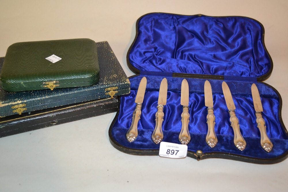 Cased set of six silver handled tea knives, a cased set: Cased set of six silver handled tea knives, a cased set of six plated tea knives, six plated cake forks and six plated coffee spoons