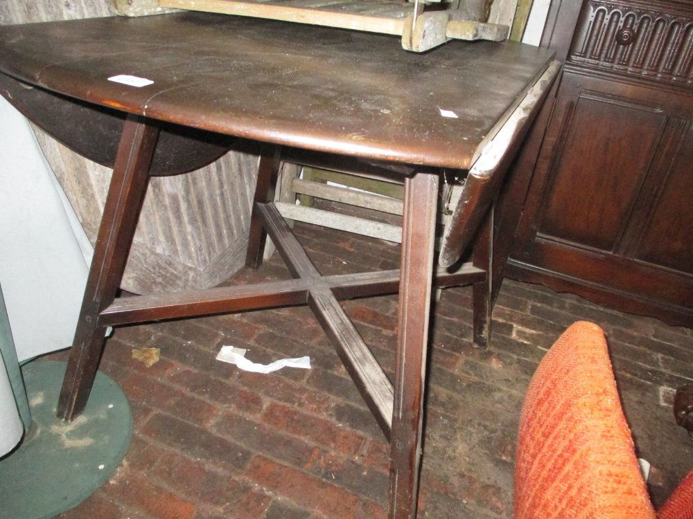 Ercol dark ash dining room suite comprising: drop-leaf: Ercol dark ash dining room suite comprising: drop-leaf dining table, four stick back chairs and a matching sideboard