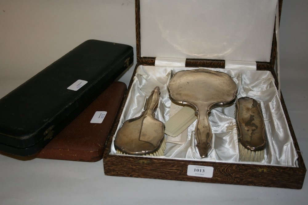 Three piece sterling silver mounted dressing table set,: Three piece sterling silver mounted dressing table set, cased set of fish knives and forks, a horn handled fish serving pair and a horn handled carving set