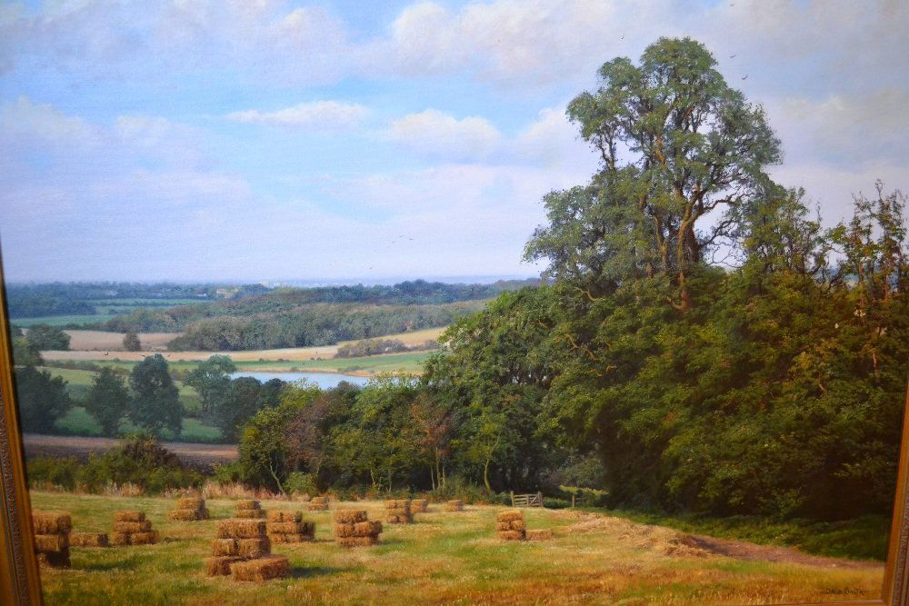 David Smith, 20th Century oil on canvas, extensive: David Smith, 20th Century oil on canvas, extensive landscape with harvested field in foreground, entitled verso ' View from Little Baddow, Essex ', signed, 34ins x 24ins, gilt framed