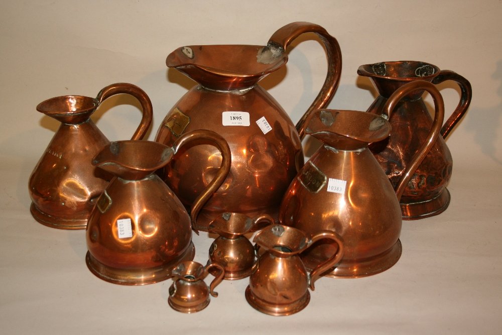 Harlequin set of eight 19th Century copper spirit: Harlequin set of eight 19th Century copper spirit flasks