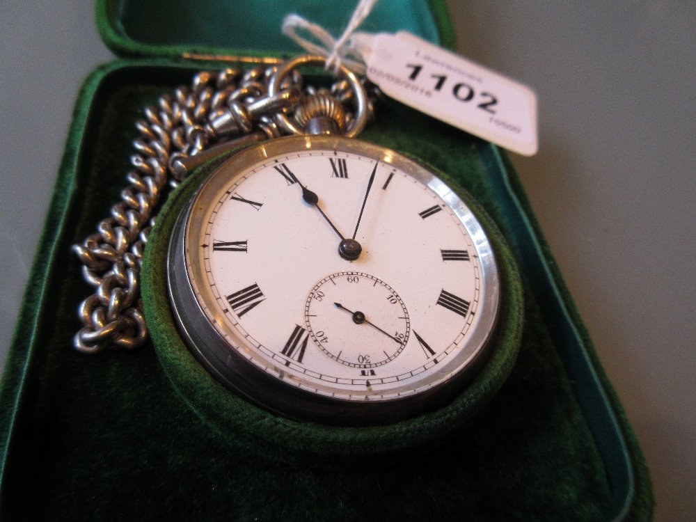 19th Century Continental silver cased open face crown: 19th Century Continental silver cased open face crown wind pocket watch with a silver Albert watch chain