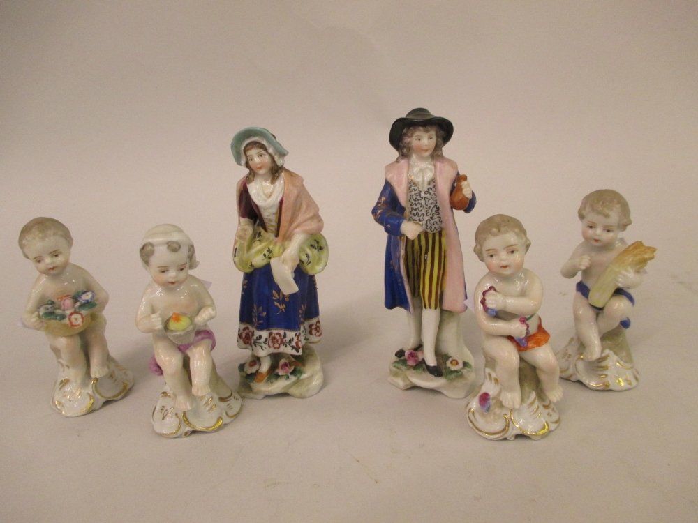 Pair of small Continental porcelain figures of a lady (1 of 1)