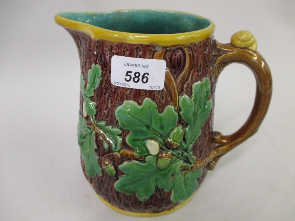 Minton Majolica jug relief moulded in the form of tree: Minton Majolica jug relief moulded in the form of tree bark, oak leaves and acorns, impressed mark to base, 8ins high approximately