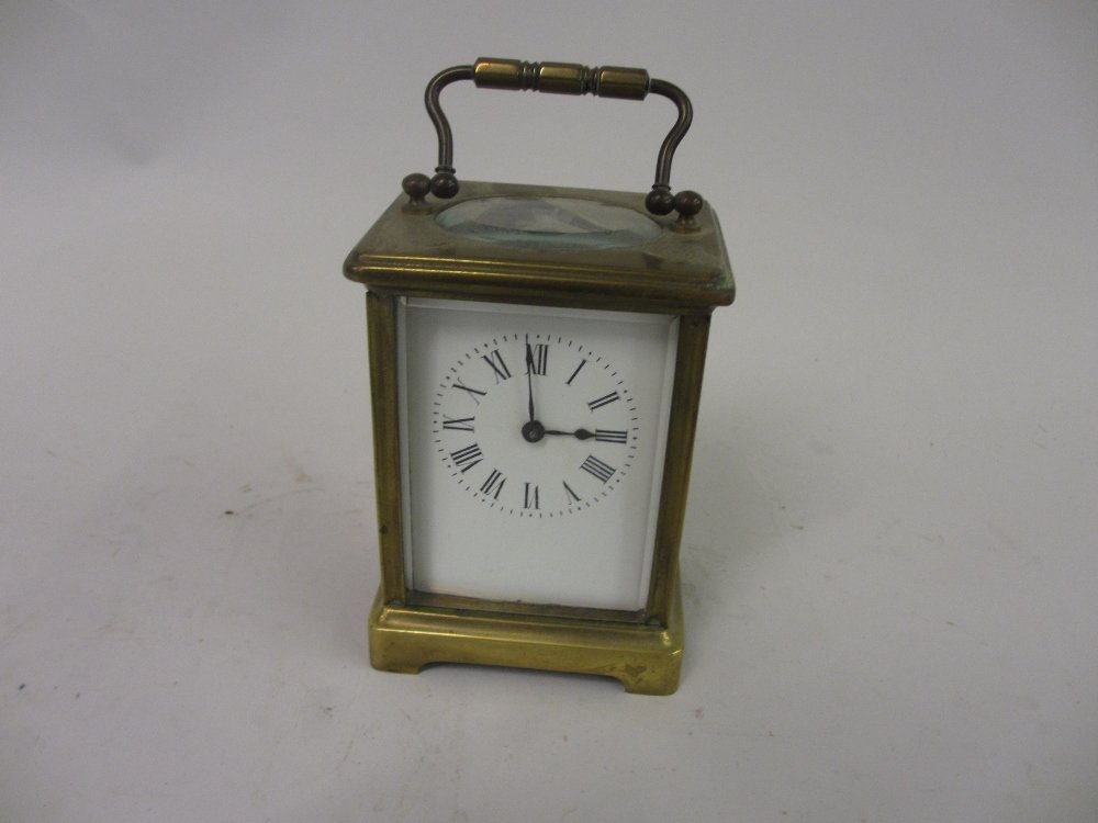 Small brass cased carriage clock, the enamel dial with (1 of 2)