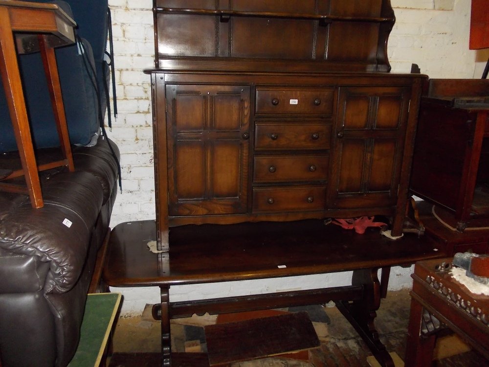 Mid 20th Century Ercol dining room suite comprising:: Mid 20th Century Ercol dining room suite comprising: refectory style table, six chairs and a dresser with boarded shelf back