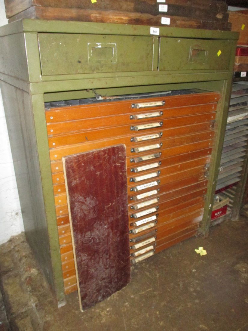 Large green painted printers type set lettering cabinet: Large green painted printers type set lettering cabinet having two metal drawers with associated blocks, equipment and letters above eighteen wooden fronted drawers containing a large quantity of vari