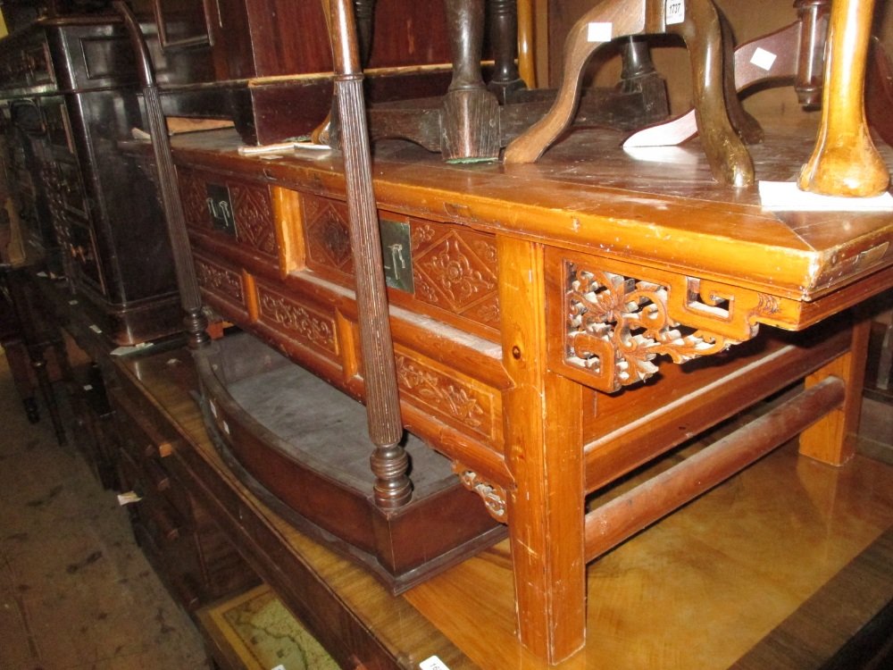 Chinese yew wood rectangular coffee table with an: Chinese yew wood rectangular coffee table with an arrangement of drawers, having carved decoration on square supports