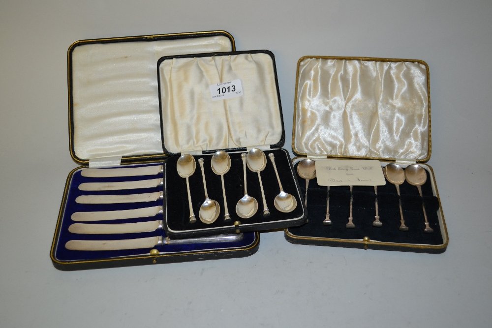 Two cased sets of six silver seal handled coffee spoons: Two cased sets of six silver seal handled coffee spoons and a set of six silver handled tea knives